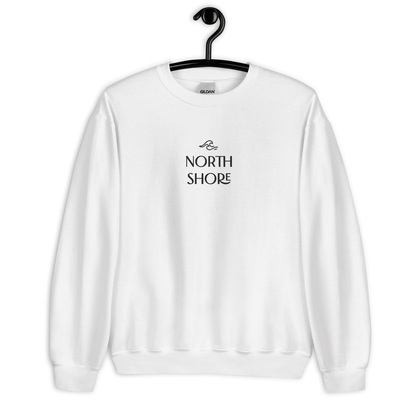 white crewneck that says "north shore" in black lettering with wave graphic