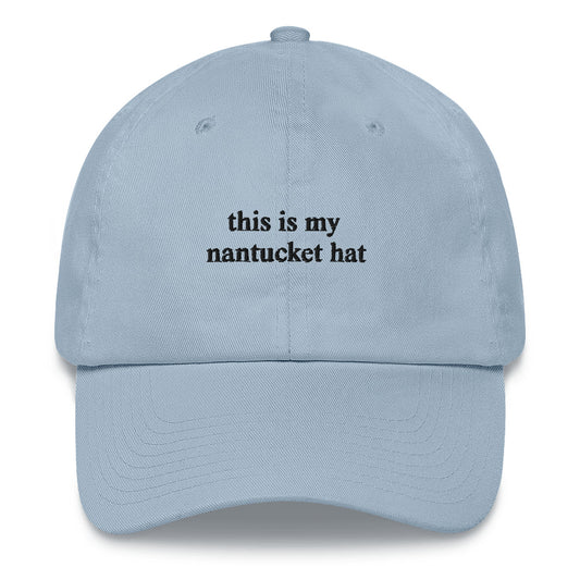 blue baseball hat that says "this is my nantucket hat" in black embroidery