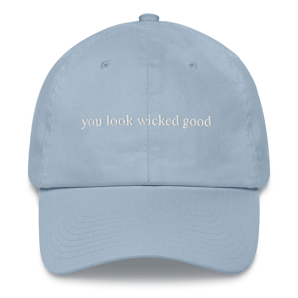 light blue hat that says "you look wicked good" in white lettering