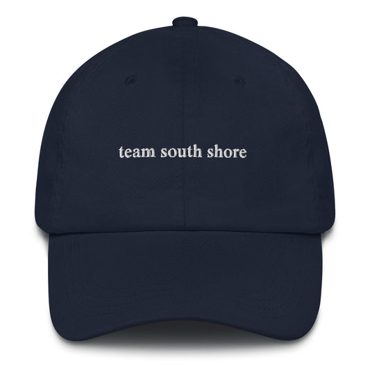 navy baseball hat that says "team south shore" in white lettering