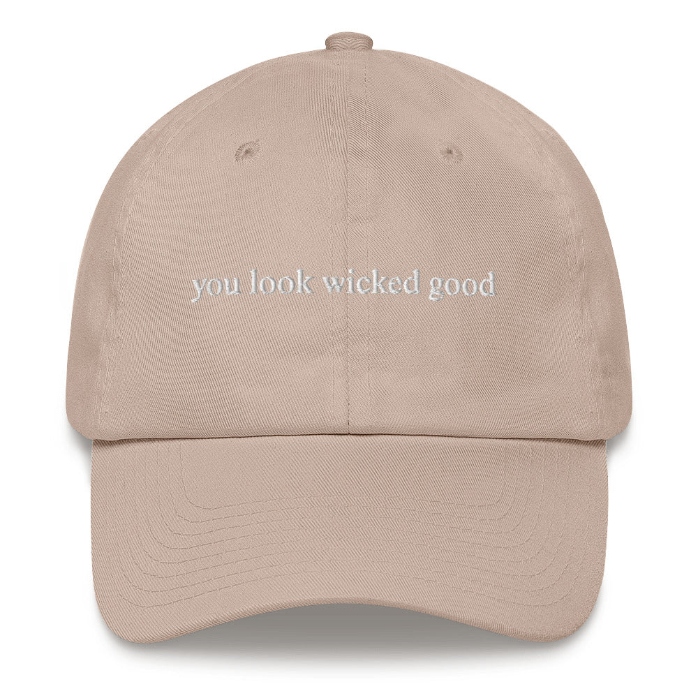 tan hat that says "you look wicked good" in white lettering