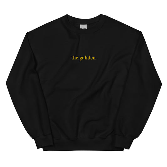 black crewneck that says "the gahden" in gold embroidery
