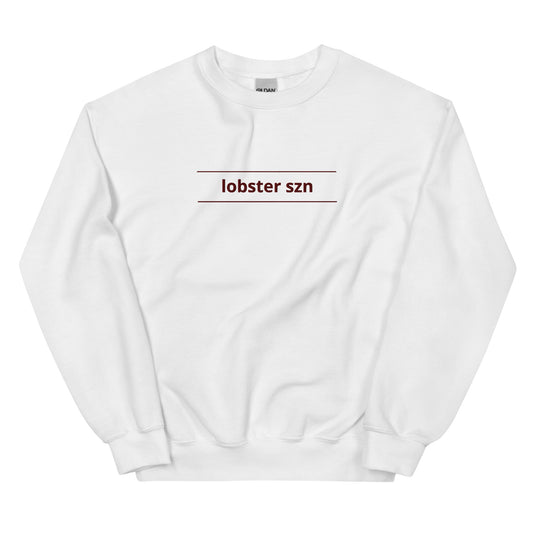 white crewneck that says "lobster szn" with two horizontal lines on top and bottom of text
