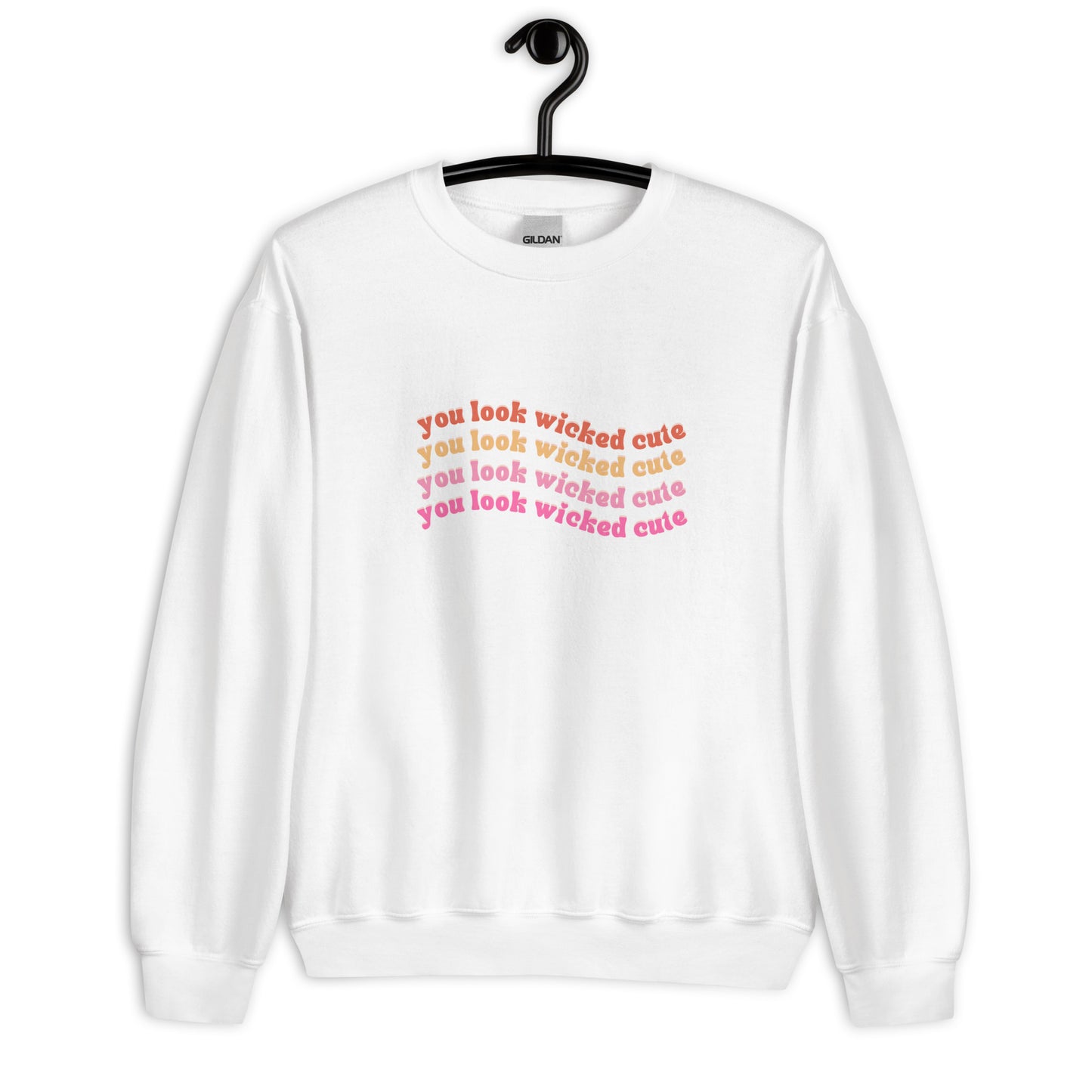 white crewneck that says "you look wicked cute" in red pink and orange lettering