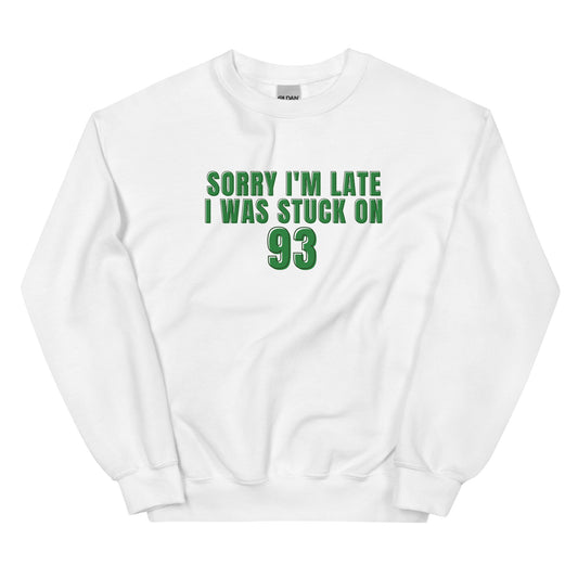 white crewneck that says "sorry i'm late i was stuck on 93" in green lettering