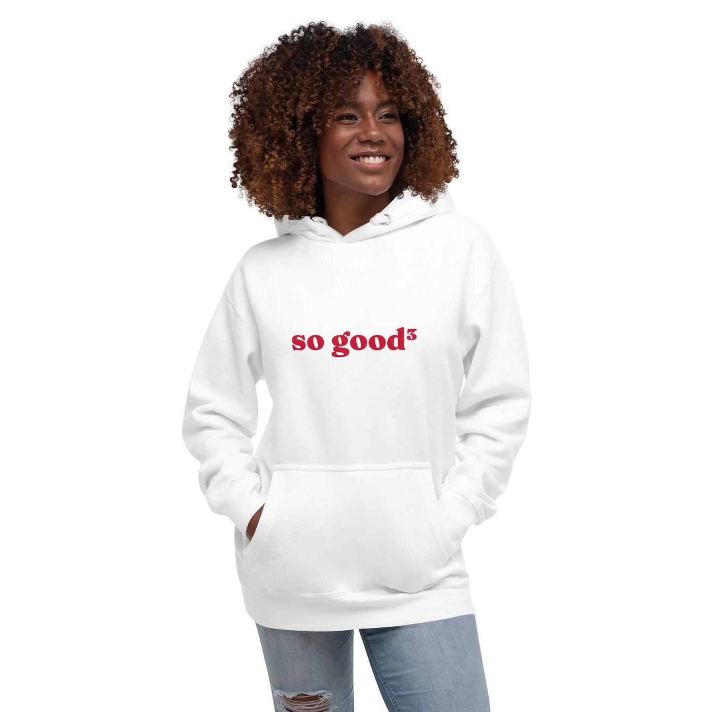woman wearing white hoodie that says "so good cubed" in red lettering