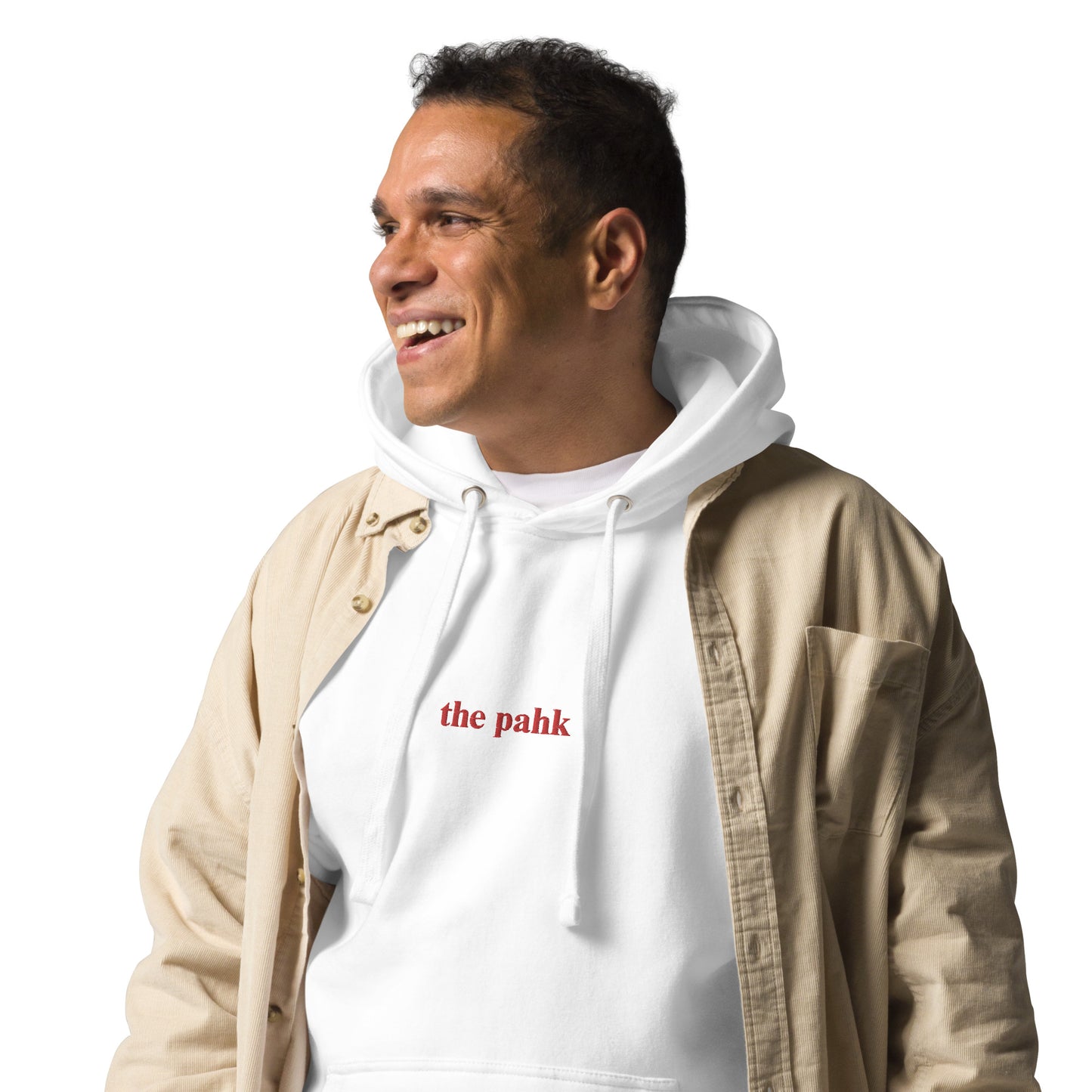 man wearing white hoodie that says "the pahk" in red embroidery