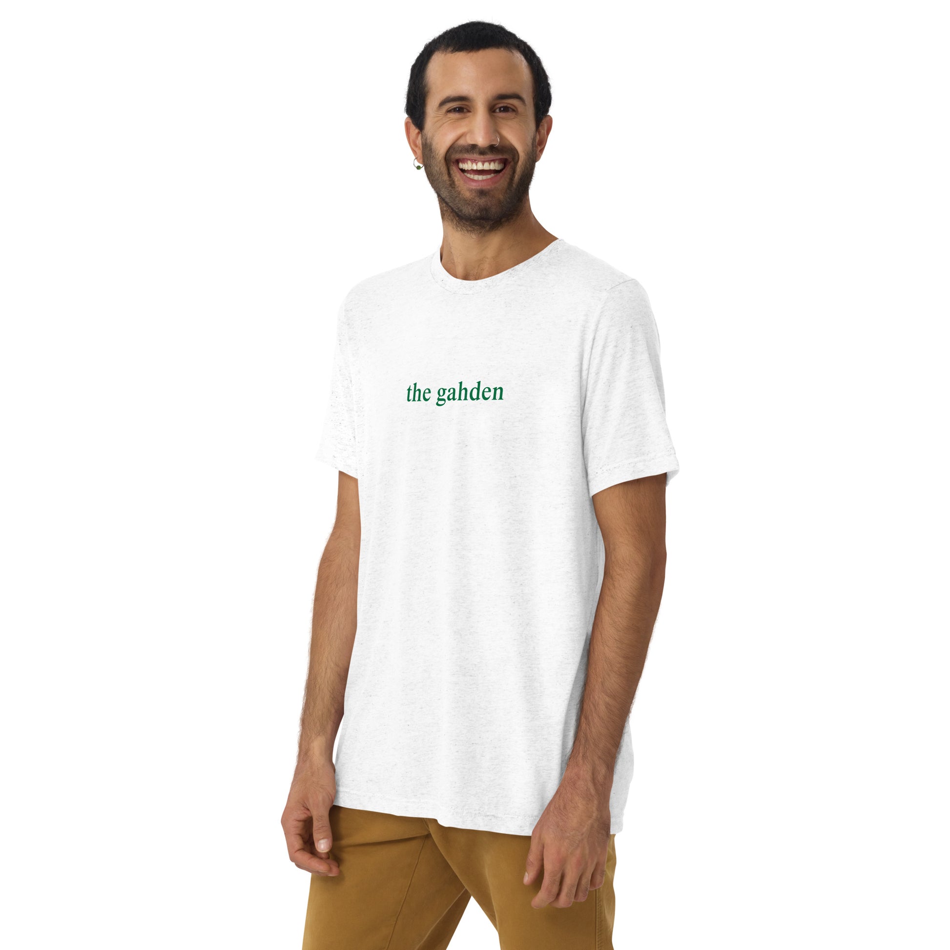 man wearing white tshirt that says "the gahden" in green lettering