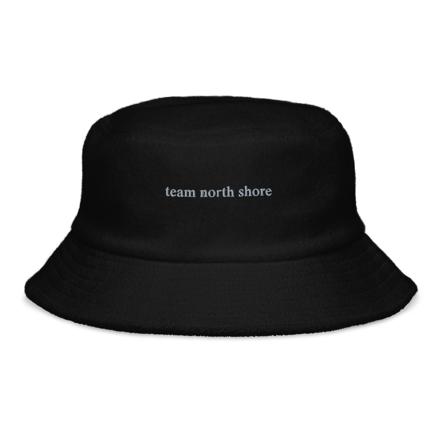 black bucket hat that says "team north shore" in grey lettering